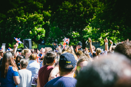 WINDSOR, , UNITED KINGDOM - MAY 19, 2018: Crowd applauding the royal wedding limousine cortege during marriage celebration of Prince Harry, Duke of Sussex and the Duchess of Sussex Meghan Markleのeditorial素材