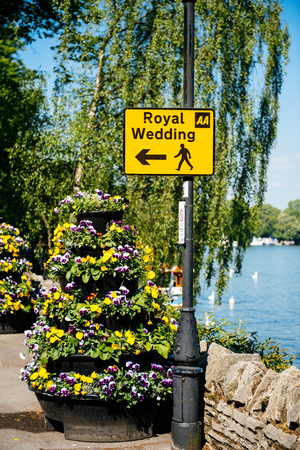 WINDSOR, UNITED KINGDOM - MAY 19, 2018: Royal Wedding yellow street sign with arrow for pedestrians to follow marriage of Prince Harry, Duke of Sussex and the Duchess of Sussex Meghan Markleのeditorial素材
