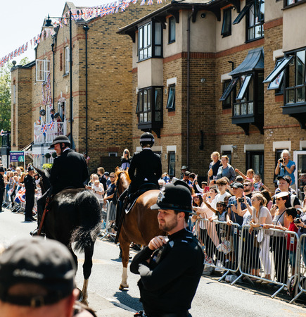 WINDSOR, UNITED KINGDOM - MAY 19, 2018: Police officers constables on horses surveilling street during royal wedding marriage celebration of Prince Harry and Meghan Markleのeditorial素材