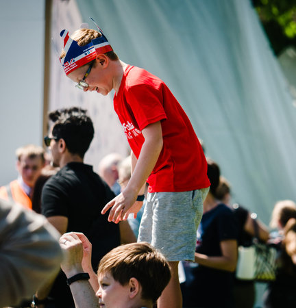 WINDSOR, BERKSHIRE, UNITED KINGDOM - MAY 19, 2018: Boy on shoulder raised enough to see the royal wedding marriage celebration of Prince Harry and Meghan Markleのeditorial素材
