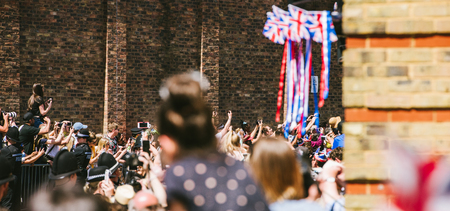 WINDSOR, BERKSHIRE, UNITED KINGDOM - MAY 19, 2018: Royal carriages approaces - taking photos of royal wedding of Prince Harry and Meghan Markleのeditorial素材
