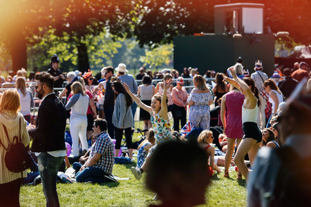 WINDSOR, BERKSHIRE, UNITED KINGDOM - MAY 19, 2018: Happy dancing girls at royal wedding marriage celebration of Prince Harry, Duke of Sussex and the Duchess of Sussex Meghan Markleのeditorial素材