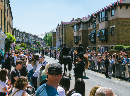WINDSOR, UNITED KINGDOM - MAY 19, 2018: Police officers constables on horses surveilling street during royal wedding marriage celebration of Prince Harry and Meghan Markleのeditorial素材