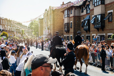 WINDSOR, UNITED KINGDOM - MAY 19, 2018: Police officers constables on horses surveilling street during royal wedding marriage celebration of Prince Harry and Meghan Markleのeditorial素材