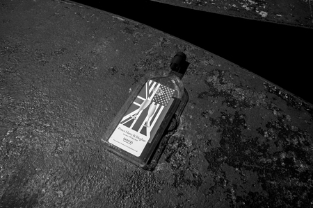 WINDSOR, BERKSHIRE, UNITED KINGDOM - MAY 19, 2018: Daniel Department store plastic wine anniversary bottle on ground after royal wedding marriage celebration of Prince Harry and Meghan Markleのeditorial素材