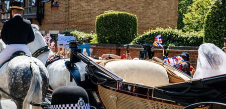 WINDSOR, BERKSHIRE, UNITED KINGDOM - MAY 19, 2018: Royal couple in carriage Prince Harry, Duke of Sussex and the Duchess of Sussex Meghan Markle - rear view detailのeditorial素材