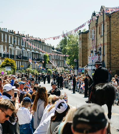 WINDSOR, UNITED KINGDOM - MAY 19, 2018: Police officers constables on horses surveilling street during royal wedding marriage celebration of Prince Harry and Meghan Markleのeditorial素材