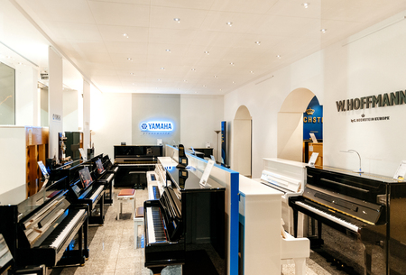 TRIER, GERMANY - FEB 21, 2015: Large classic store with Luxury piano shop musical instrument store selling exclusive pianos and royal grand piano by W.Hoffmann by C. Bechsteinand Yamaha Pianoworldのeditorial素材