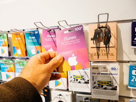 FRANKFURT, GERMANY - OCT 6, 2017: Man hand point of view customer shopping for the prepaid 100 euro...