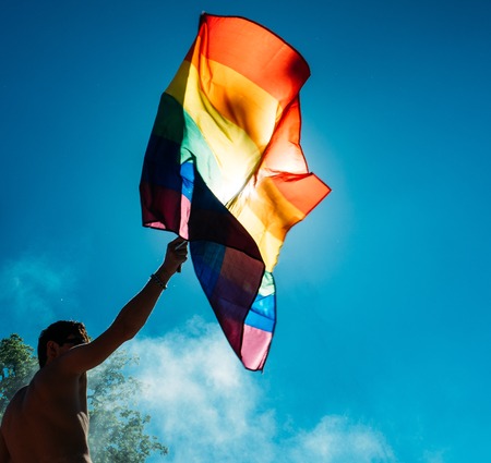 STRASBOURG, FRANCE - JUN 10, 2017: Caucasian excited gay men waving rainbow flag at Lesbian Gay Bisexual Transgender LGBT visibility march pride Festigays in Juneのeditorial素材
