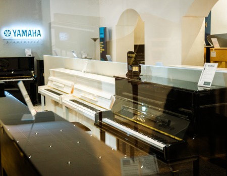 TRIER, GERMANY - FEB 21, 2015: Luxury P  Series Yamaha piano shop musical instrument store selling exclusive pianos and royal grand piano by Yamaha Pianoworldのeditorial素材