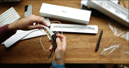 PARIS, FRANCE - APR 12 2018: POV man unboxing unpacking latest Apple Watch Series 3 GPS LTE smartwatch - inspecting the build qualityのeditorial素材