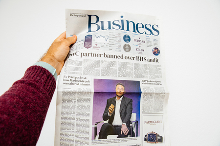 PARIS, FRANCE - JUN 13, 2018: The Daily Telegraph Business page cove with portrait of Elon Musk CEO of tesla saying he is cutting 9 percent of jobsのeditorial素材