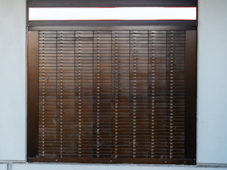 Detail of multiple Bank Deposit Boxes on a wall each of them numbered with dedicated number