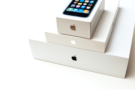 LONDON, UNITED KINGDOM - JAN 14, 2015: Three Apple Computers products packages boxes on top on a white background - unboxing smartphone iPhone, iPad and MacBook pro laptopのeditorial素材