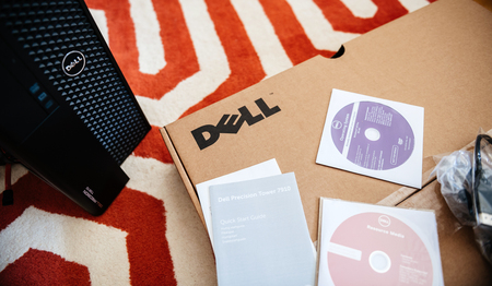 LONDON, UNITED KINGDOM - JUN 15, 2017: Home floor with unboxing of new Dell Precision T7910 workstation computer box containing multiple Operating System OS DVD's and drivers on CD-drive resource mediaのeditorial素材