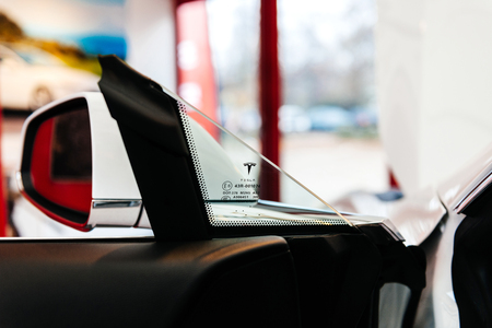 PARIS, FRANCE - NOV 29, 2014: New Tesla Model S electric car detail of the logotype on the driver windowのeditorial素材