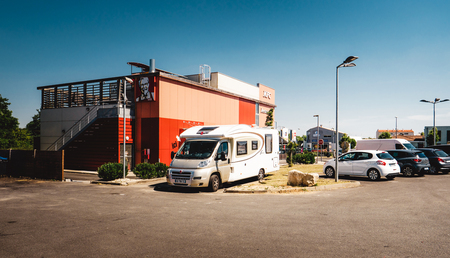 LA ROCHELLE, FRANCE - JUNE 28, 2018: KFC restaurant with RV mobile home parked on the parking during national French holidayのeditorial素材