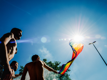 STRASBOURG, FRANCE - JUN 10, 2017: Caucasian excited gay men people waving rainbow flag at Lesbian Gay Bisexual Transgender LGBT visibility marchのeditorial素材