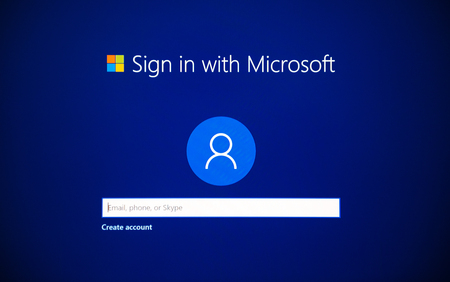 LONDON, UNITED KINGDOM - JUN 15, 2017: Blue screen detail with sign in with Microsoft account with email, skype, phone during Microsoft Windows installation and activation on a new PC workstationのeditorial素材