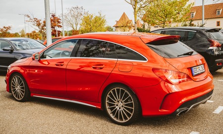 AUGSBURG, GERMANY - OCT 7, 2018: Rear left side view of modern luxury red Mercedes Benz estate car parked in German cityのeditorial素材