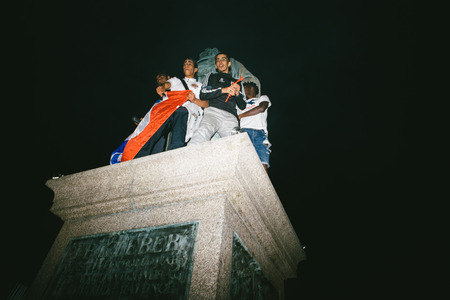 STRASBOURG, FRANCE - JULY 10, 2018: People on General Kleber statue after the victory of France qualify for the final of the 2018 FIFA World Cup after their victory over Belgium 1-0のeditorial素材