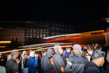 STRASBOURG, FRANCE - JULY 10, 2018: Lightrails over happy ambiance on Central Place Kleber after the victory of France qualify for the final of the 2018 FIFA World Cup after their victory over Belgium 1-0のeditorial素材