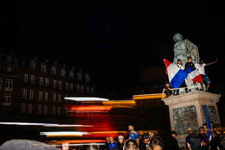 STRASBOURG, FRANCE - JULY 10, 2018: Lightrails over happy ambiance on Central Place Kleber after the victory of France qualify for the final of the 2018 FIFA World Cup after their victory over Belgium 1-0のeditorial素材