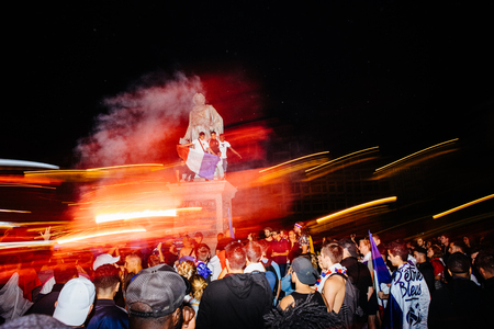 STRASBOURG, FRANCE - JULY 10, 2018: People celebrating happy ambiance on Central Place Kleber after victory of France qualify for final of 2018 FIFA World Cup victory over Belgium 1-0 - lightrailsのeditorial素材