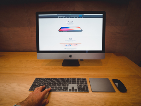 STRASBOURG, FRANCE - JAN 11, 2018: Front view of new black iMac Pro the all-in-one personal computer in Apple Computers Store. Apple claims the iMac Pro is the most powerful workstation - hand working on keyboardのeditorial素材