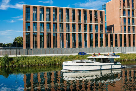 STRASBOURG, FRANCE - JUNE 25, 2018: Luxury yacht in front of Turkish embassy in Strasbourg construction site on Quai Jacoutot Ill River during summer with clear blue skyのeditorial素材