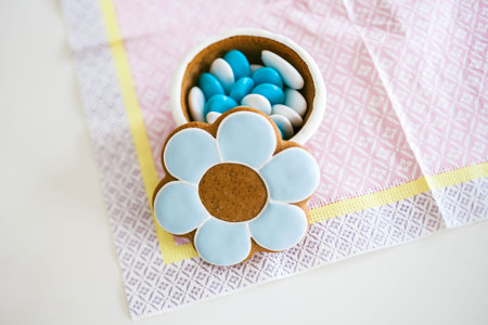 Baptism Christening sweets gifts on delicate napkin with open lid made from dough and marzipan paste...