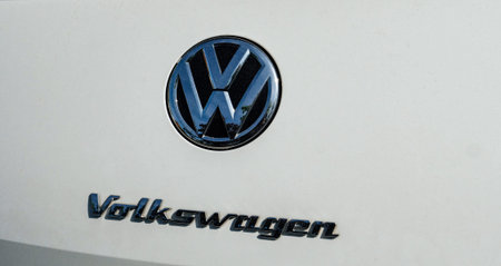 FRANKFURT, GERMANY - APR 29, 2018: Closeup of shiny Volskwagen metal emblem and car brand name on...