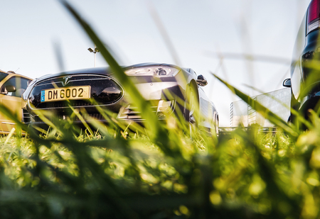 STRASBOURG, FRANCE - SEP 3, 2017: Side view of shiny New Tesla Model S modern electric car with elegant design in dark gray color outdoorsのeditorial素材