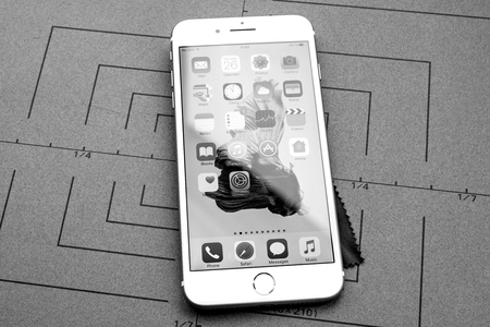 PARIS, FRANCE - SEP 26, 2016: New Apple iPhone  8 Plus smartphone after unboxing with home screen and multiple apps - black and whiteのeditorial素材