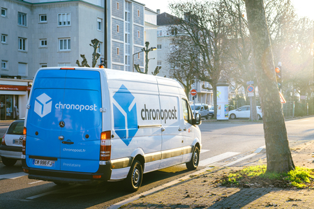 STRASBOURG FRANCE - DEC 19, 2016: DPD from La Poste delivery vans in center of the city on sunny street early in the morning. Chronopost and DPD is part of French group La posteのeditorial素材