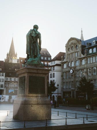 STRASBOURG, FRANCE - SEP 12, 2018: Beautiful General Kleber statue with pedestrians walking int the empty central square in Strasbourgのeditorial素材