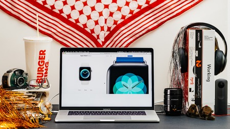 LONDON, UK - SEP 13, 2018: Creative room table with Safari Browser on MacBook Pro laptop showcasing Apple Computers website latest Apple Watch series 4 new breath appのeditorial素材