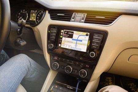 STRASBOURG, FRANCE - SEP 15, 2018: Apple carplay on the dashboard display of a modern car commuting...