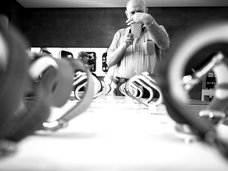STRASBOURG, FRANCE - SEP 21, 2018: Apple Store with senior male taking photo on Nokia Smartphone admiring the new latest Watch Series 4 wearable devices with diverse strapsのeditorial素材
