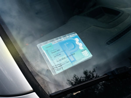 VEERE, NETHERLANDS - AUG 25, 2018: Windshiled sticker permit with parkeerbeheer gemeente tilburg translated as parking management municipality tilburg in Dutch cityのeditorial素材
