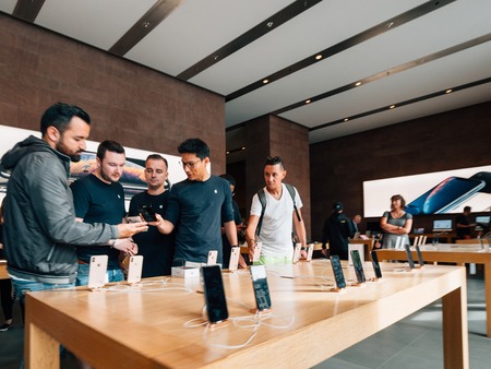 STRASBOURG, FRANCE - SEP 21, 2018: Apple genius in Apple Store with customers people explaining about the newest iPhone Xs and Xs Max preorder for Xr and Watch Series 4 wearableのeditorial素材