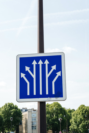 Blue informational traffic sign post over a clear blue sky showing multiple branching of avenues in Paris, France with clear blue sky in the bacgrkoundの写真素材