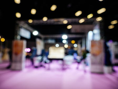 Dofucsed wedding exhibition with silhouettes of people and customers and exhibitions preparing for the marriage eventの写真素材