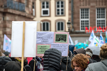 STRASBOURG, FRANCE - MAR 22, 2018: People gathering in Place Kleber square during CGT General Confederation of Labour demonstration protest against Macron French government string of reforms - people with placards in central squareのeditorial素材