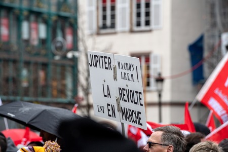 STRASBOURG, FRANCE - MAR 22, 2018: CGT General Confederation of Labour workers with placard at demonstration protest against Macron French government string of reforms - people with Jupiter Macron posterのeditorial素材
