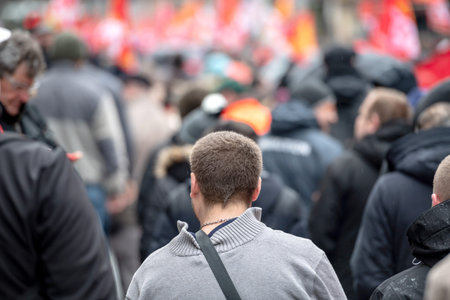 STRASBOURG, FRANCE - MAR 22, 2018: Rear view of crowd of protesters at CGT General Confederation of...