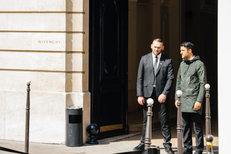 PARIS, FRANCE - MAY 21, 2016: Security guards at the entrance of Givenchy haute couture luxury...