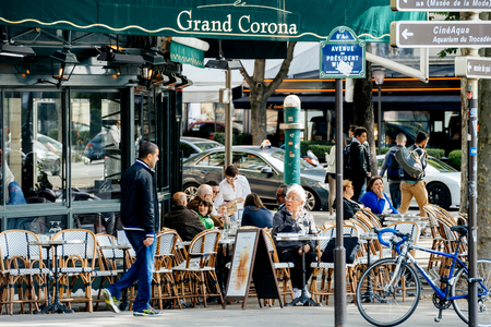 PARIS, FRANCE - MAY 21, 2016: People senioors and adults, locals and tourists having breakfast in Grand Corona Restaurant Parisのeditorial素材