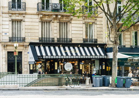 PARIS, FRANCE - MAY 21, 2016: People having breakfast in Berts Restaurant in  Paris near the...